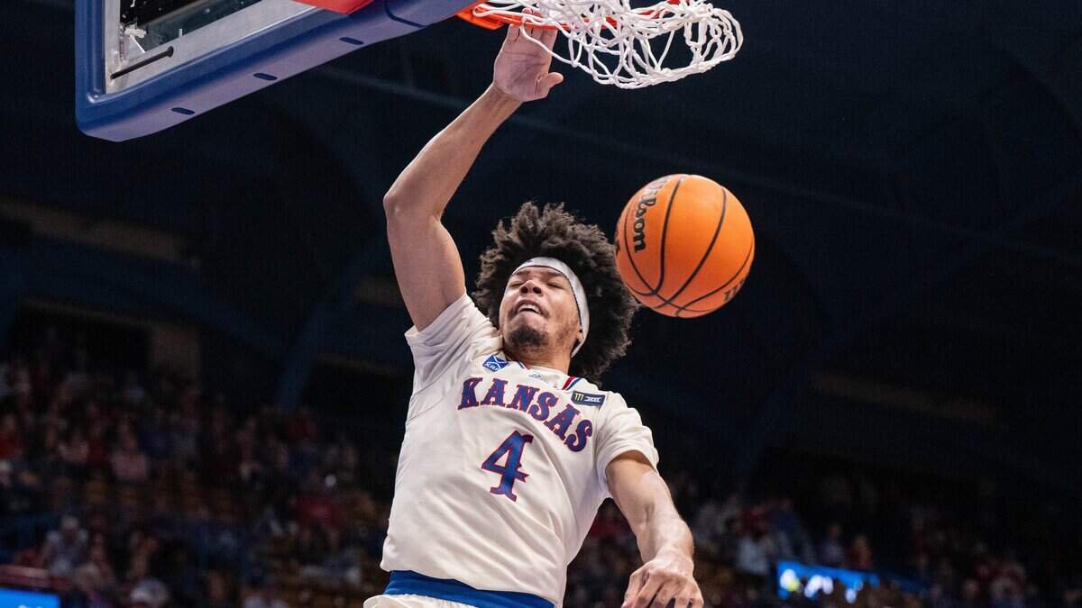 Kansas Jayhawks guard Tyran Stokes dunks the ball in the Jayhawks exhibition game vs. Pittsburg State Gorillas, on Friday, October 16, 2026, at Allen Fieldhouse. The exhibition game, a first for Late Night in the Phog, replaces the normal format of variety show style sketches and a team scrimmage.