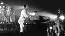 Fela Kuti on stage playing keyboard