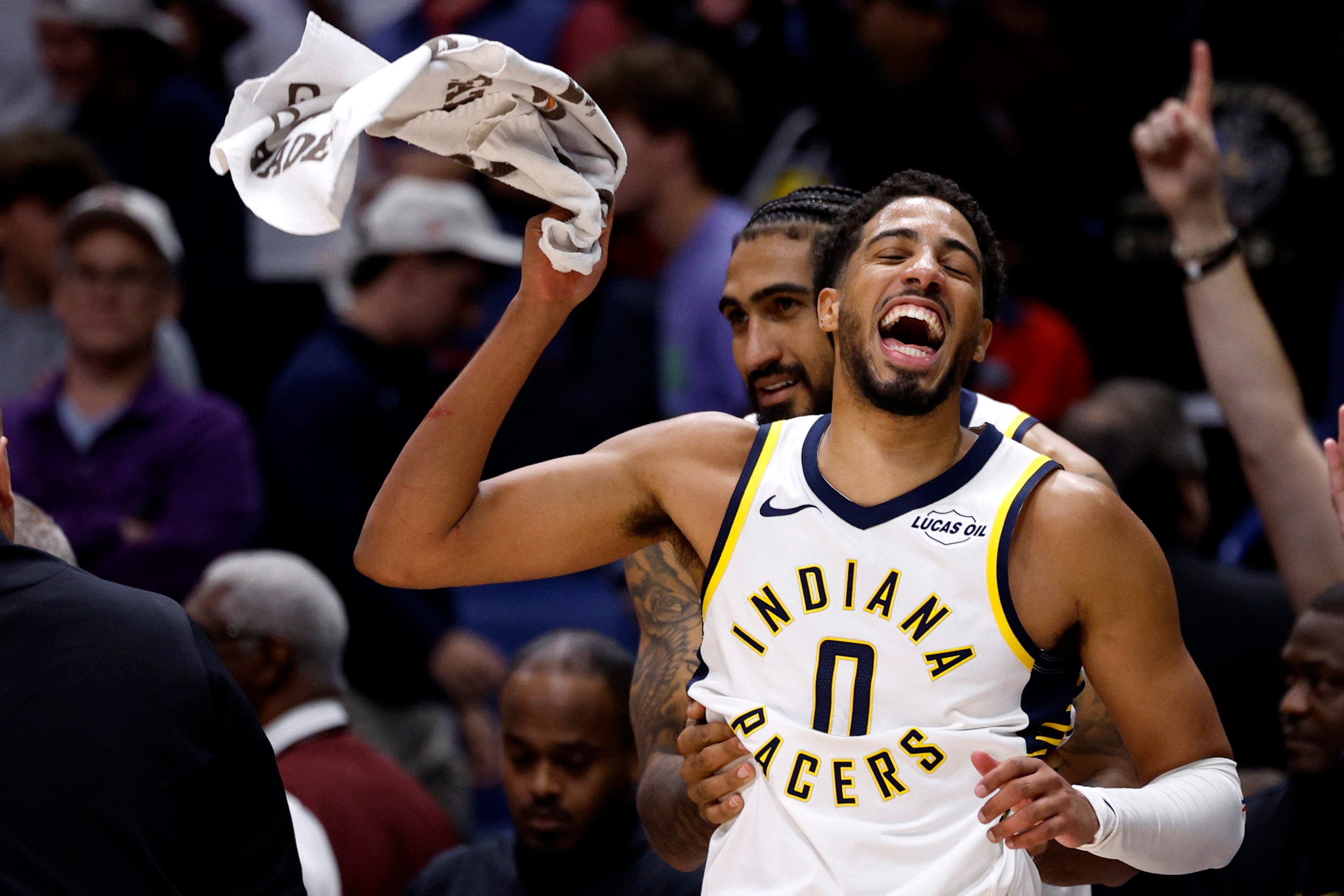Tyrese Haliburton #0 and Obi Toppin #1 of the Indiana Pacers celebrate a 123-120 win over the New Orleans Pelicans at Smoothie King Center on Oct. 21, 2026, in New Orleans.