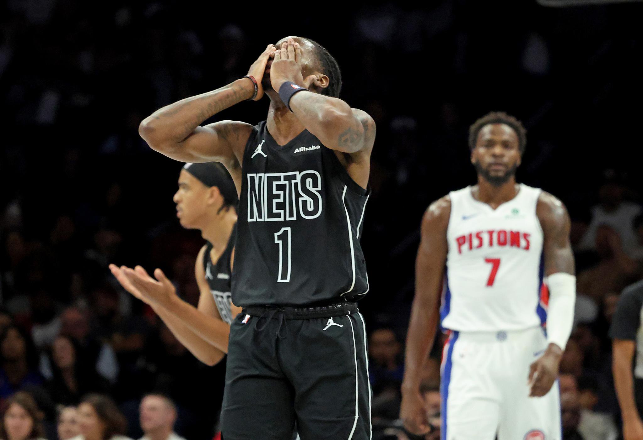 Brooklyn Nets guard Keon Ellis reacts with his hands on his face during a game against the Detroit Pistons.