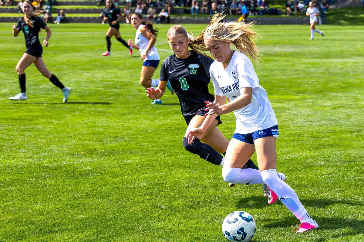 Richland sophomore Jordyn Thompson (8) battles Gonzaga Prep senior Jolina Olson (3) for the ball during a non-league girls soccer match Saturday, Sept. 5, 2026, at Richland High School. Thompson is among a group of younger players first-year girls coach Mike Pardini identified as players to watch this season.