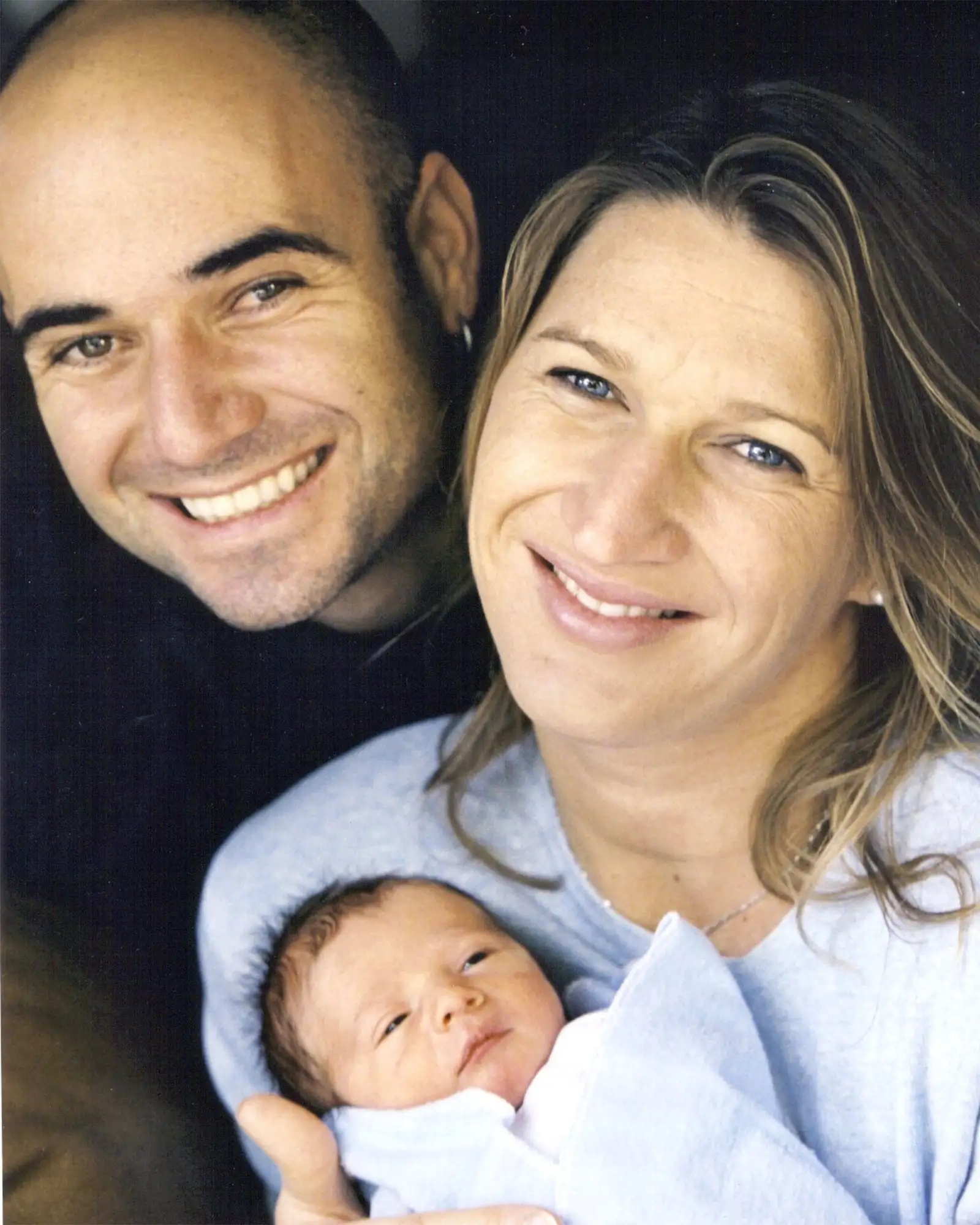 Tennis players Andre Agassi and Steffi Graf hold their new son Jaden Gil October 27, 2001 in Las Vegas, NV. 