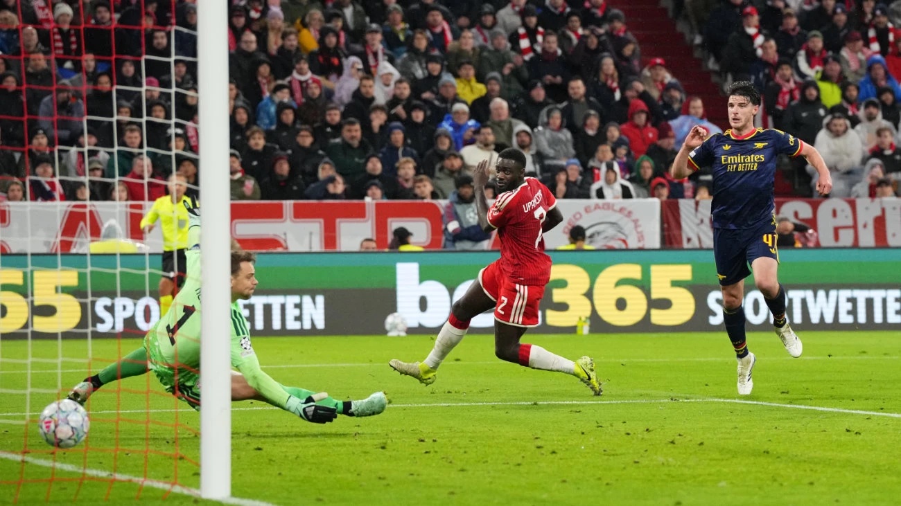 Arsenal's Declan Rice scores his side's second goal against Bayern's goalkeeper Manuel Neuer during the Champions League opening phase soccer match between Bayern and Arsenal in Munich, Germany, Wednesday, Oct. 21, 2026. (AP)