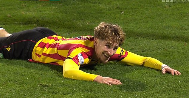 Seb Drozd lies smirking on the ground after winning a contentious penalty for Partick Thistle