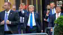 Donald Trump arriving at Trump Tower pumping fist