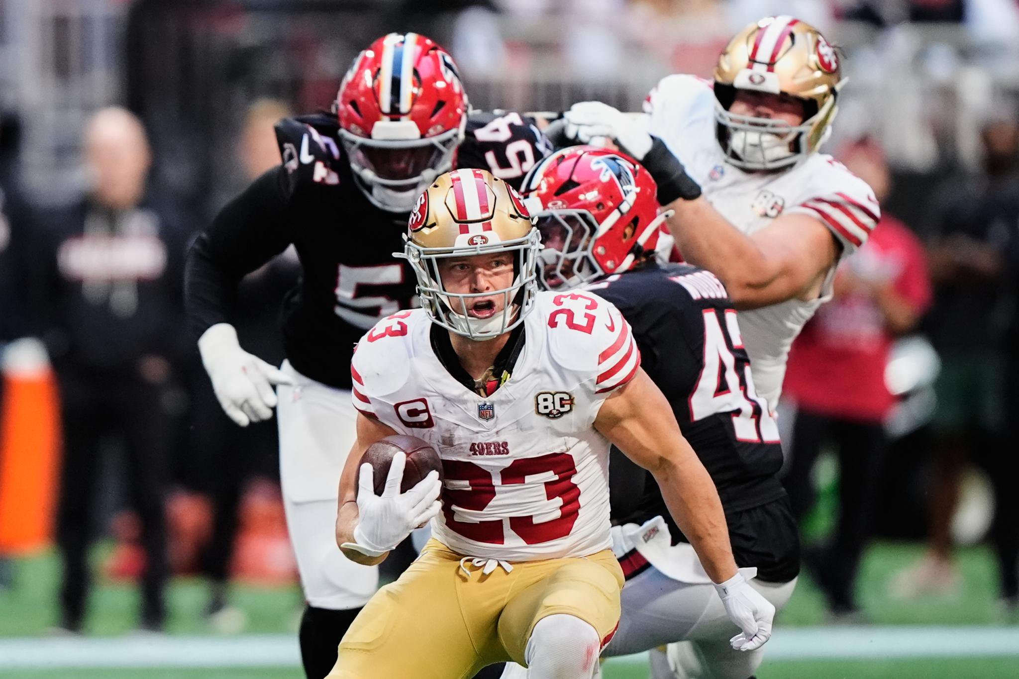 San Francisco 49ers running back Christian McCaffrey runs the ball during a game against the Atlanta Falcons.