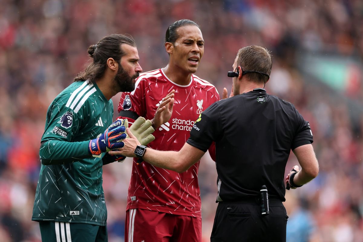 Alisson Becker and Virgil van Dijk of Liverpool appeal to Referee Samuel Barrott after he awarded a penalty to Nottingham Forest during the Premier League 2026/27 match between Liverpool FC and Nottingham Forest FC at Anfield