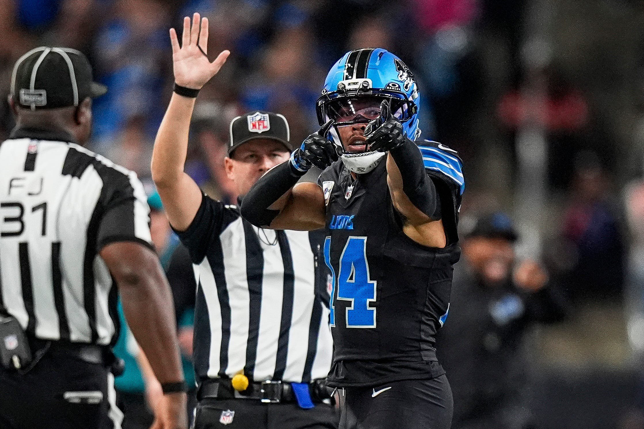 Detroit Lions wide receiver Amon-Ra St. Brown (14) celebrates a first down against Green Bay Packers during the first half at Ford Field in Detroit on Sunday, Oct. 25, 2026.