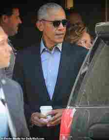 Barack was seen leaving his hotel on Thursday (pictured) - while Michelle attended the US Open in Queens on Friday