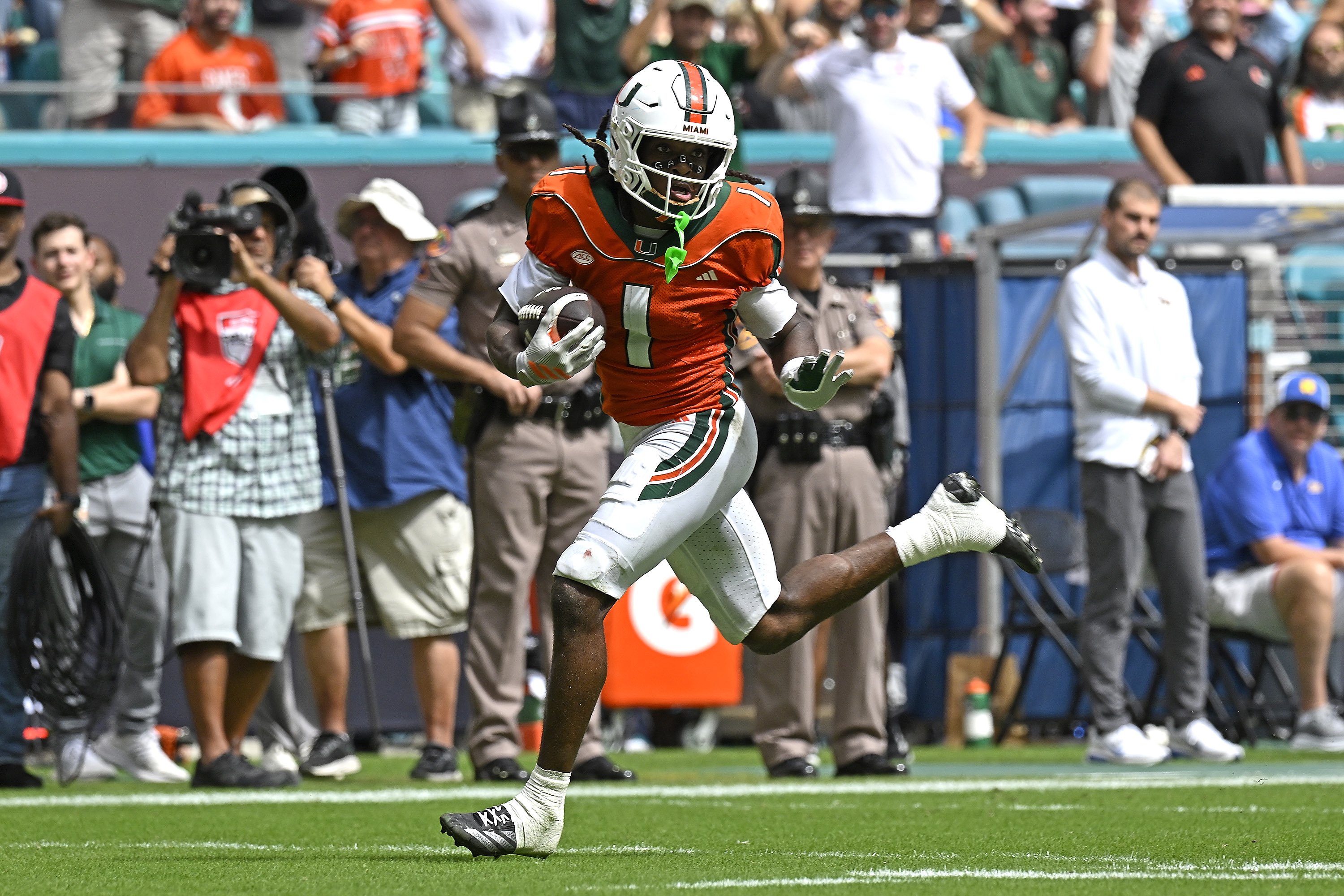 MIAMI GARDENS - OCTOBER 24:  Miami wide receiver Malachi Toney (1) takes a reception 53 yards for a touchdown in the second quarter as the Miami Hurricanes faced the Pittsburgh Panthers on October 24, 2026, at Hard Rock Stadium in Miami Gardens, FL. (Photo by Samuel Lewis/Icon Sportswire via Getty Images)