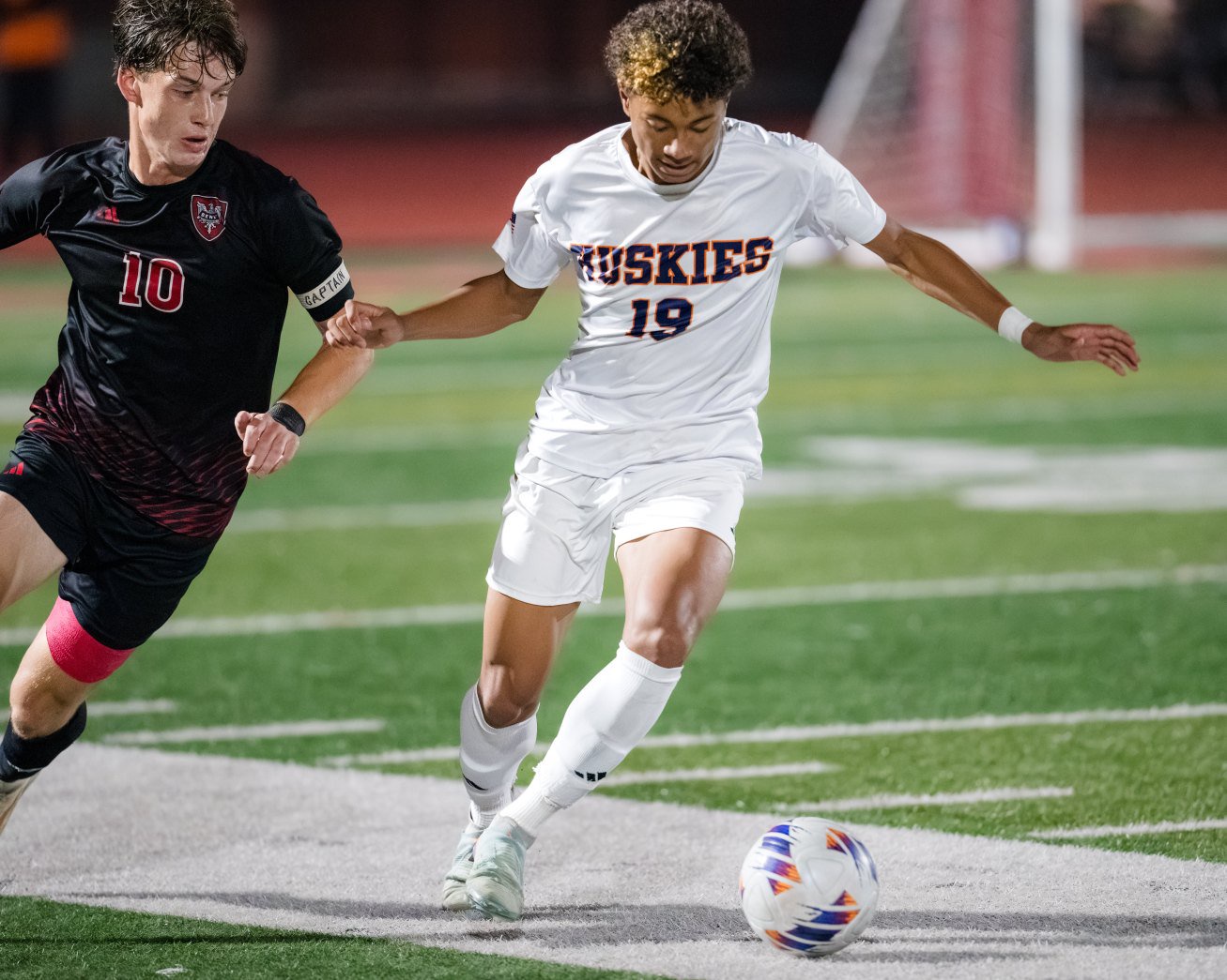 Naperville North’s Isaac Baria (19) dribbles the ball near the sideline against Benet during a Class 3A East Aurora Sectional semifinal game in Aurora on Tuesday, Oct. 27, 2026. (Jeremy Toney / Naperville Sun)