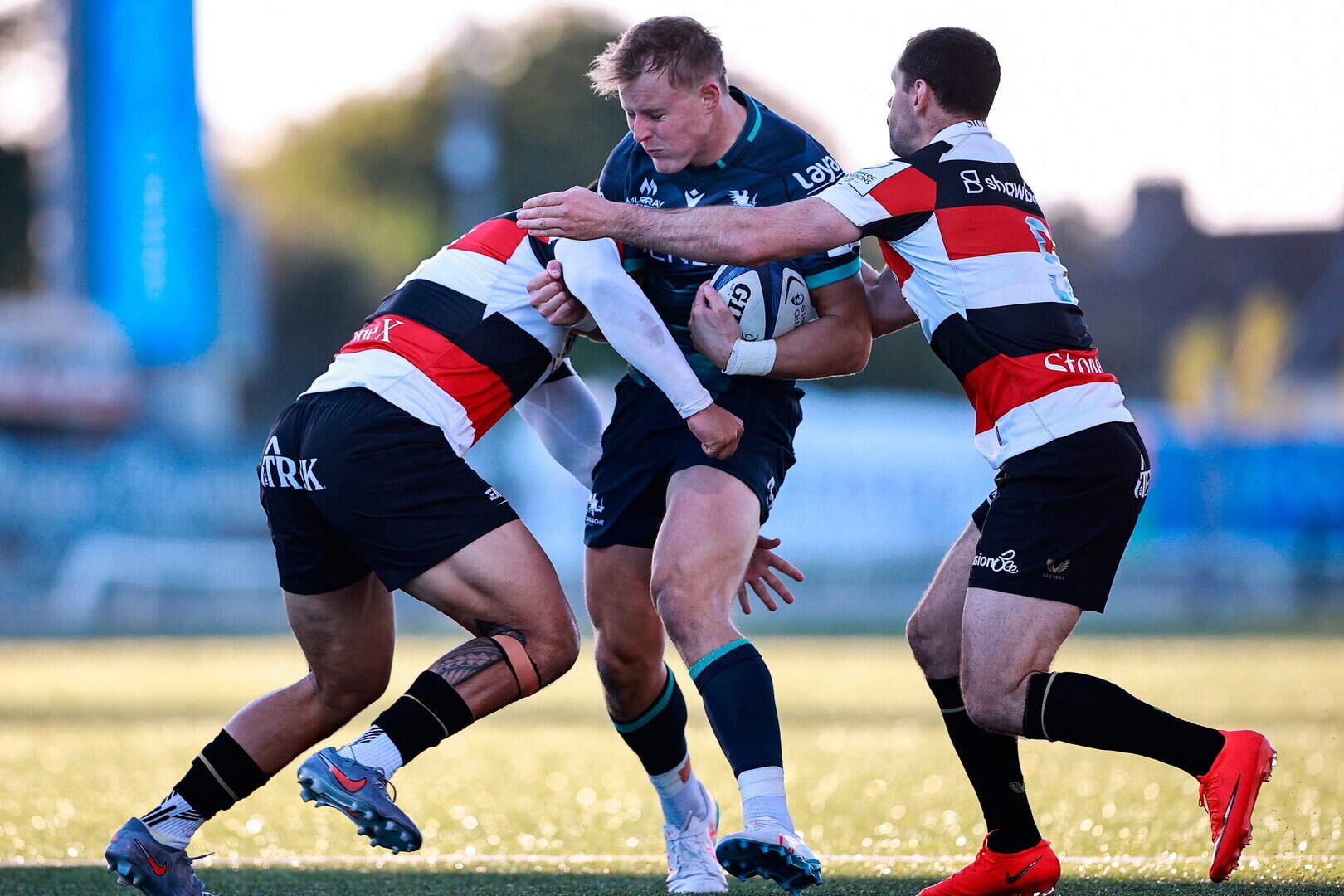 Sam Gilbert of Connacht is tackled by Saracens players, from left, Jamie George and Tomos Williams during the Champions Cup match at Dexcom Stadium in Galway