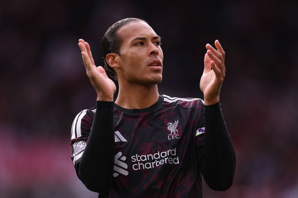 Virgil van Dijk of Liverpool applauds the fans
