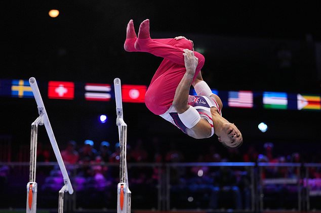Joe Fraser, of Britain, competes in the the parallel bars during the men's all-around final at the Artistic Gymnastics World Championships in Rotterdam, the Netherlands, Thursday, Oct. 22, 2026. (AP Photo/Francisco Seco)