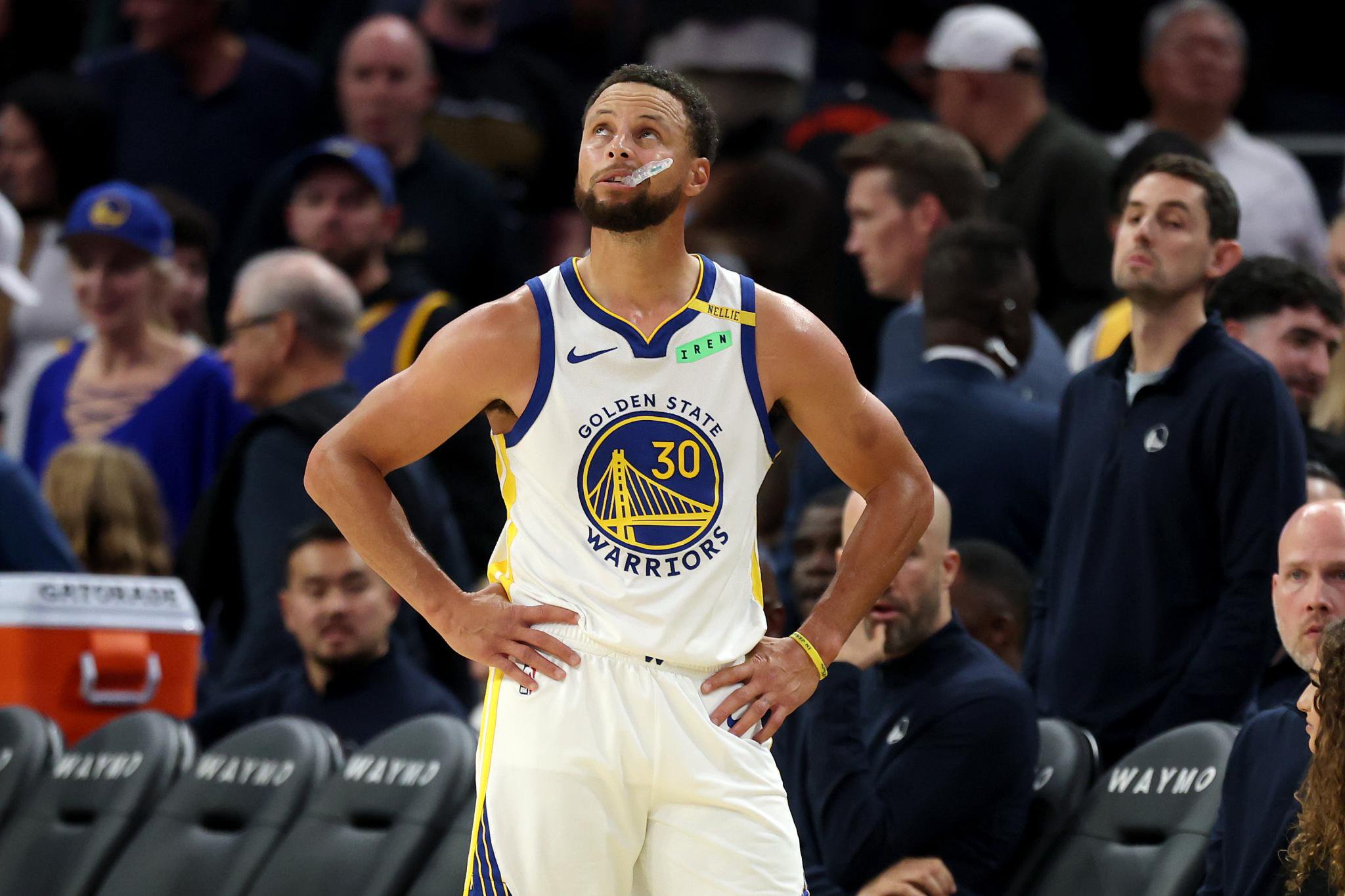 Stephen Curry of the Golden State Warriors stands on the side of the court during a loss to the Memphis Grizzlies.