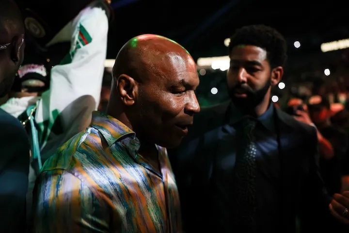 Mike Tyson walks David Benavidez to the ring for his fight against Gilberto Ramirez on Saturday at T-Mobile Arena in Las Vegas. (May 2, 2026)