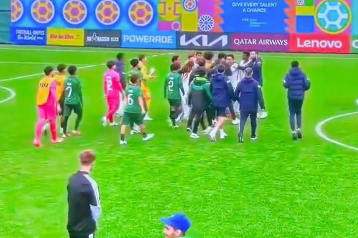 England players rush to protect referee