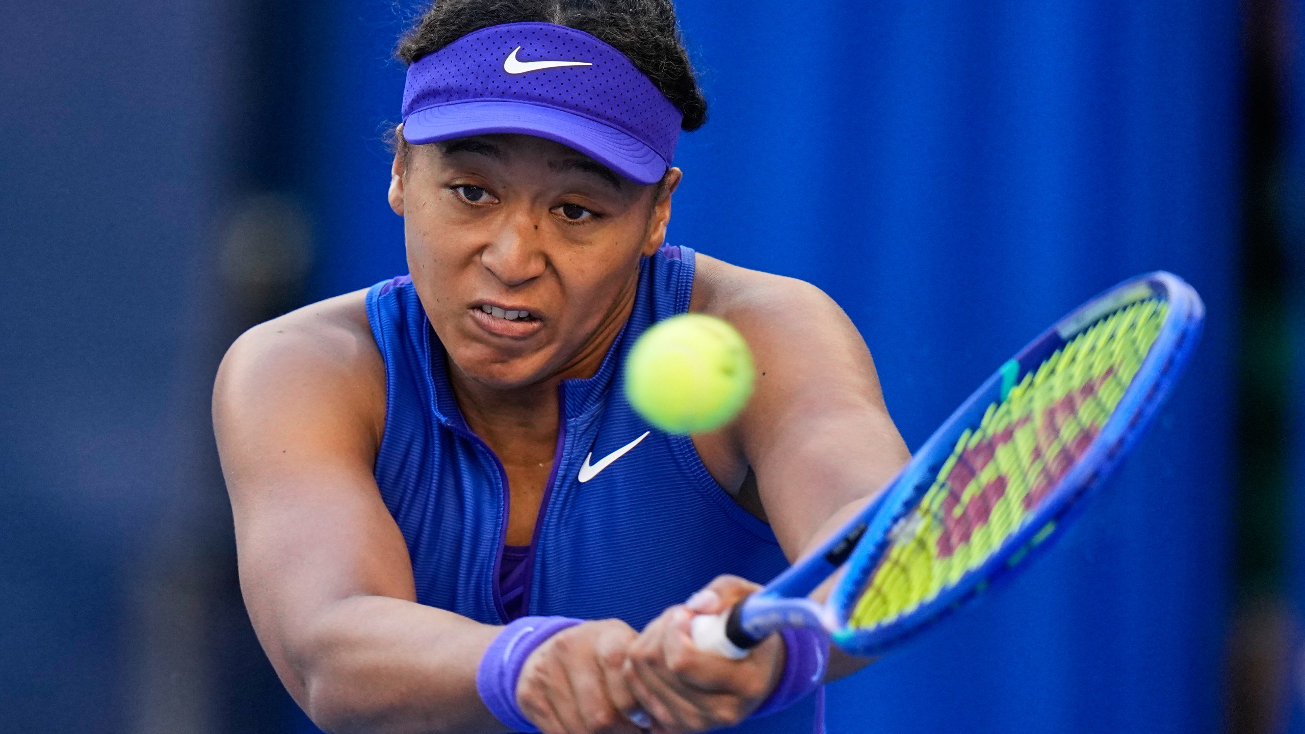 Naomi Osaka, of Japan, returns a ball to Karolina Muchova, of the Czech Republic, during the fourth round of the women's singles match at the China Open tennis tournament in Beijing, Tuesday, Oct. 6, 2026. (AP Photo/Andy Wong)