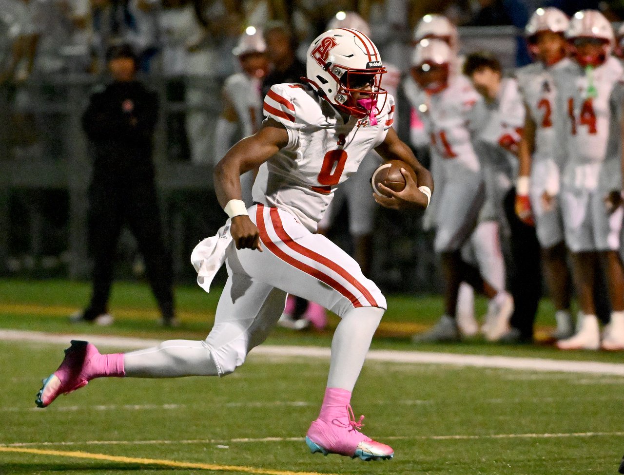 Archbishop Spalding Cavaliers Brian Snowden Jr. #9 gains positive yards on a quarterback keeper during the second quarter. The Archbishop Spalding Cavaliers visit the St. Mary\xe2\x80\x99s Saints in a high school football matchup Friday evening. (Paul W. Gillespie/Staff)