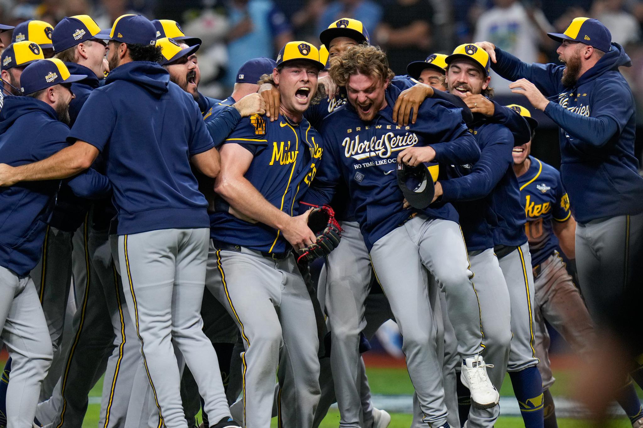 Trevor Megill (center), who recorded the final out, and his teammates celebrate after their 4-1 World Series-clinching Game 5 win over the Rays on Oct. 28, 2026 in St. Petersburg, Fla.
