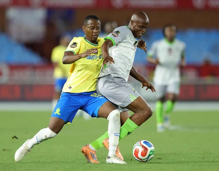 Samkele Sihlali of Marumo Gallants challenged by Thabo Cele of Mamelodi Sundowns during their Carling Knockout Cup last 16 match at Loftus Versfeld Stadium. 