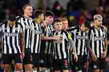Kieran Trippier of Newcastle United looks dejected among team mates during the penalty shootout during the Carabao Cup Quarter Final match between ...