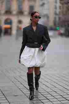 Woman wears black jacket and bubble skirt