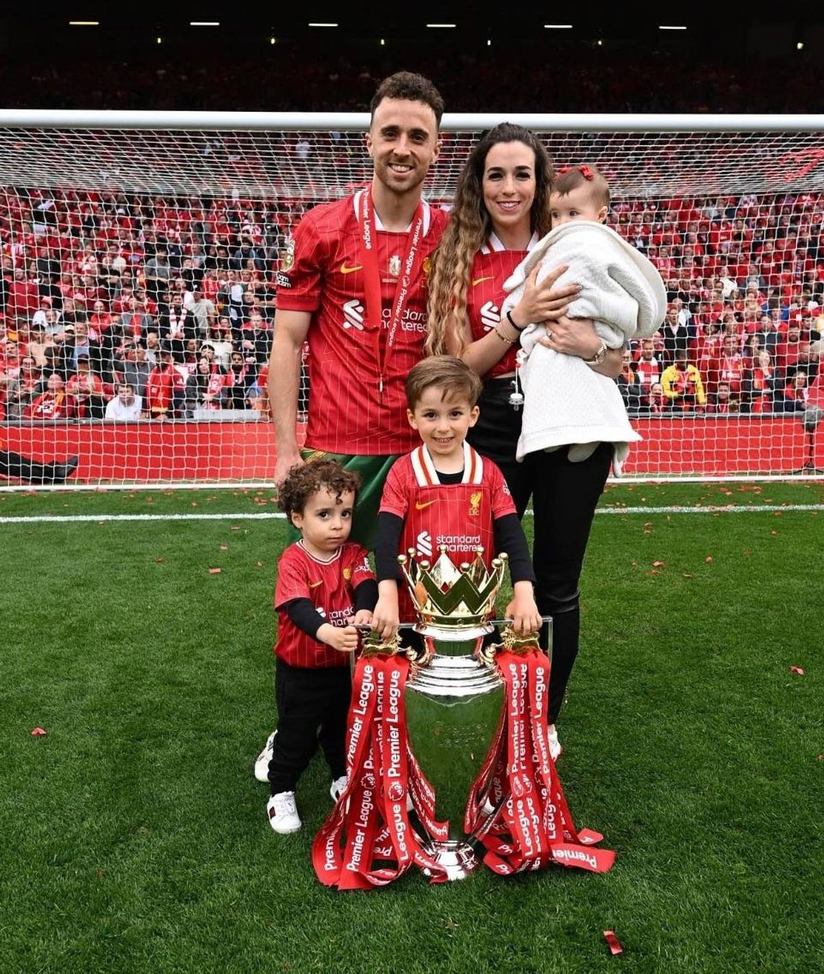 Diogo Jota with his wife Rute and their three young kids on the pitch
