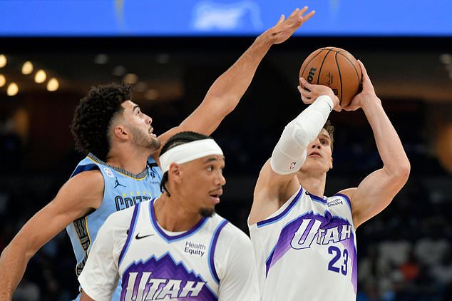 Utah Jazz forward/center Lauri Markkanen (23) shoots against guard Jahmai Mashack, left, in the first half of an NBA basketball game Wednesday, Oct. 21, 2026, in Memphis, Tenn. (AP Photo/Brandon Dill)