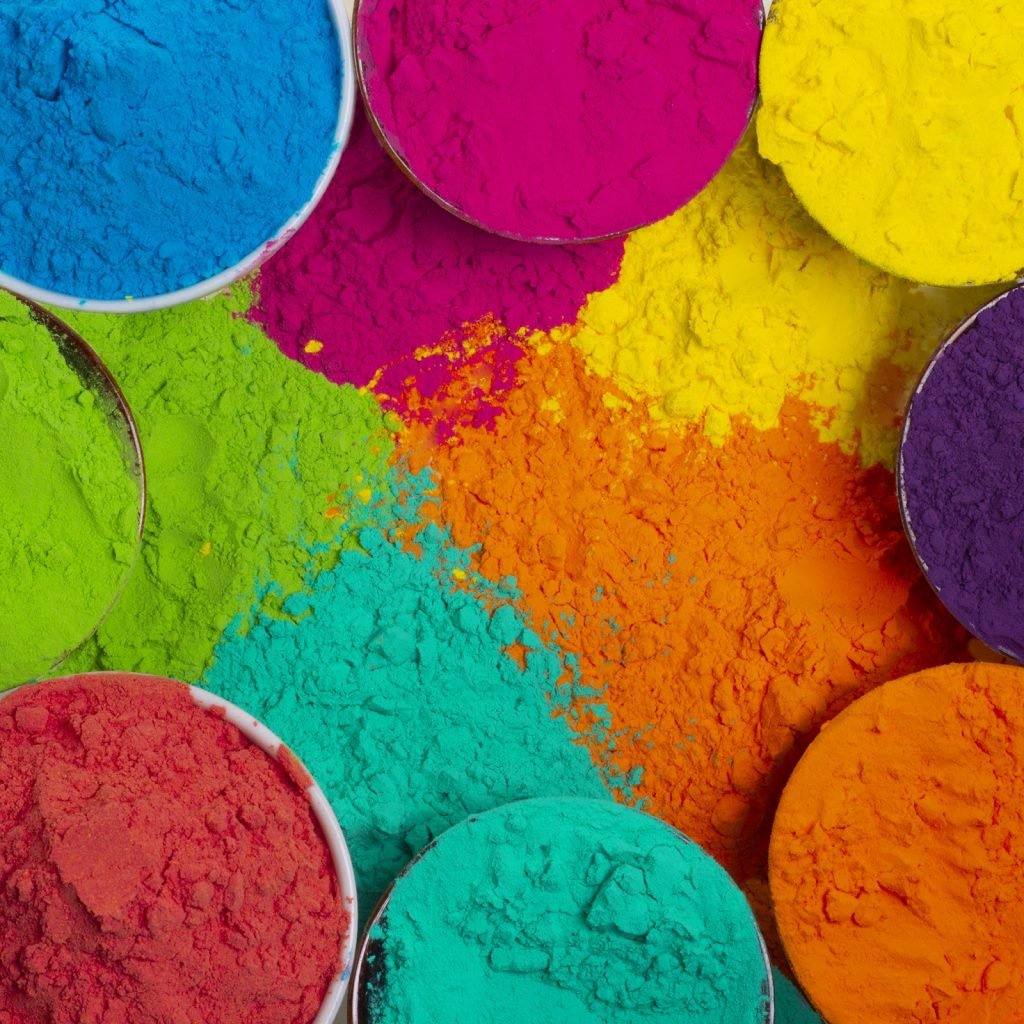 Different colors of pigment powder in small jars