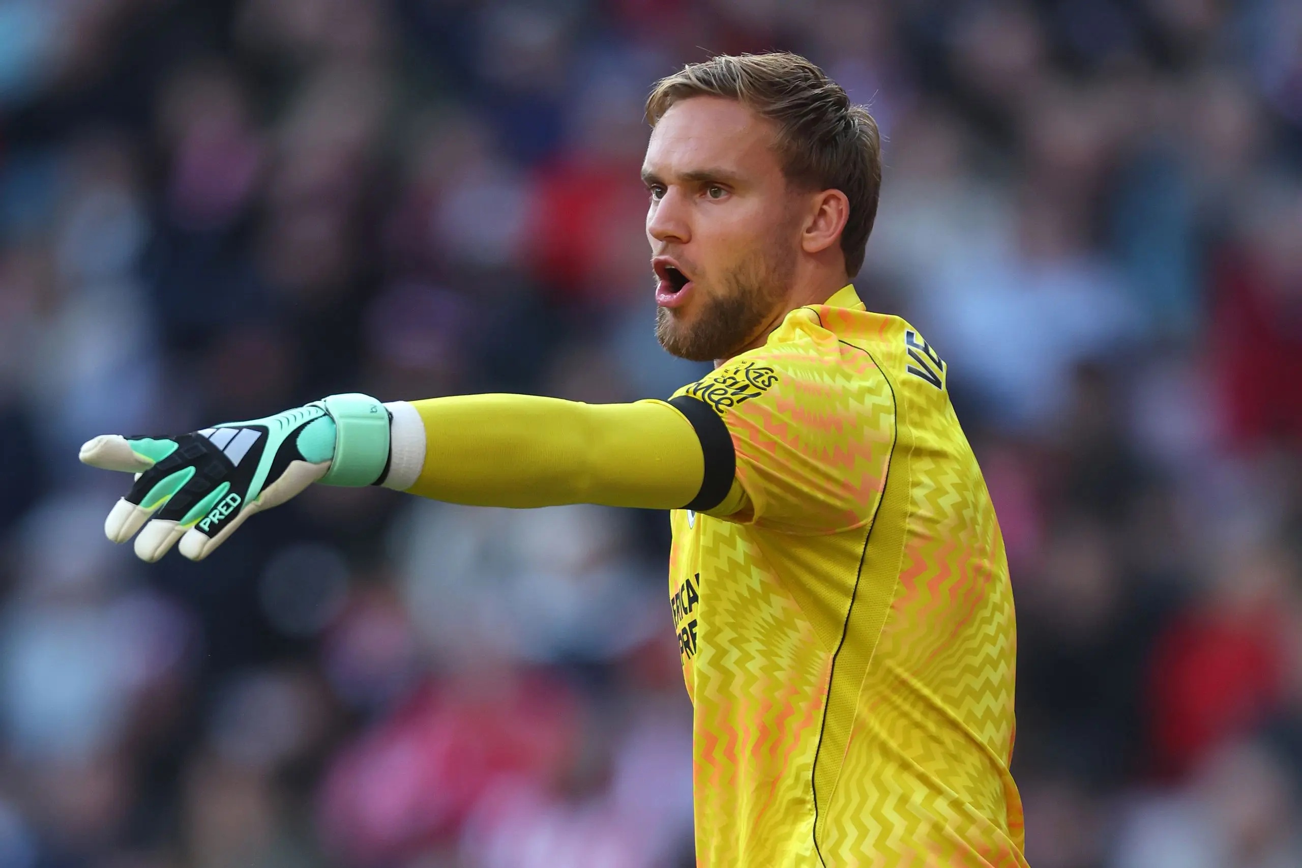 Bart Verbruggen, Goalkeeper of Brighton and Hove Albion, pointing.