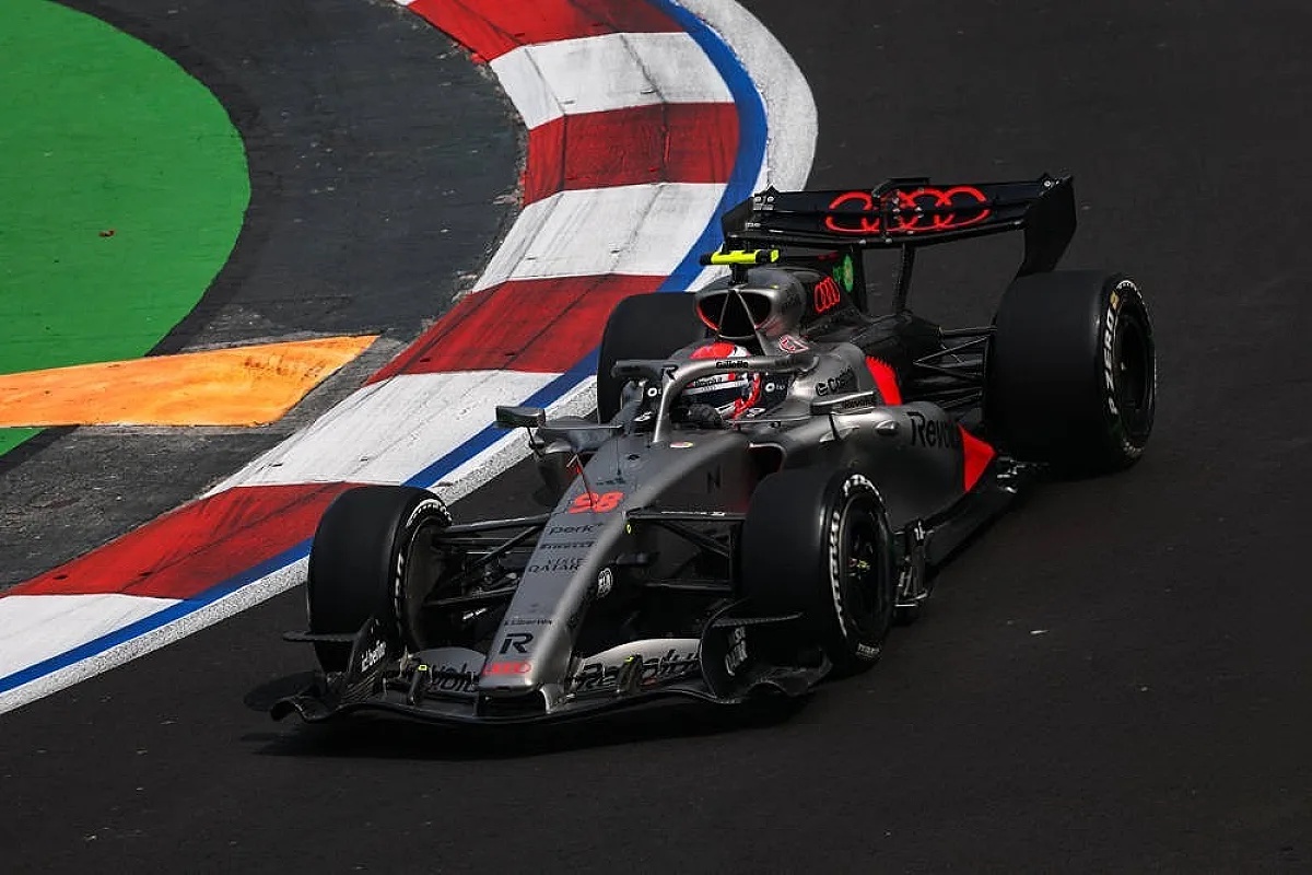 Audi F1 car with number 29 and driver in helmet on track past red-and-white kerbs at Mexico City Grand Prix