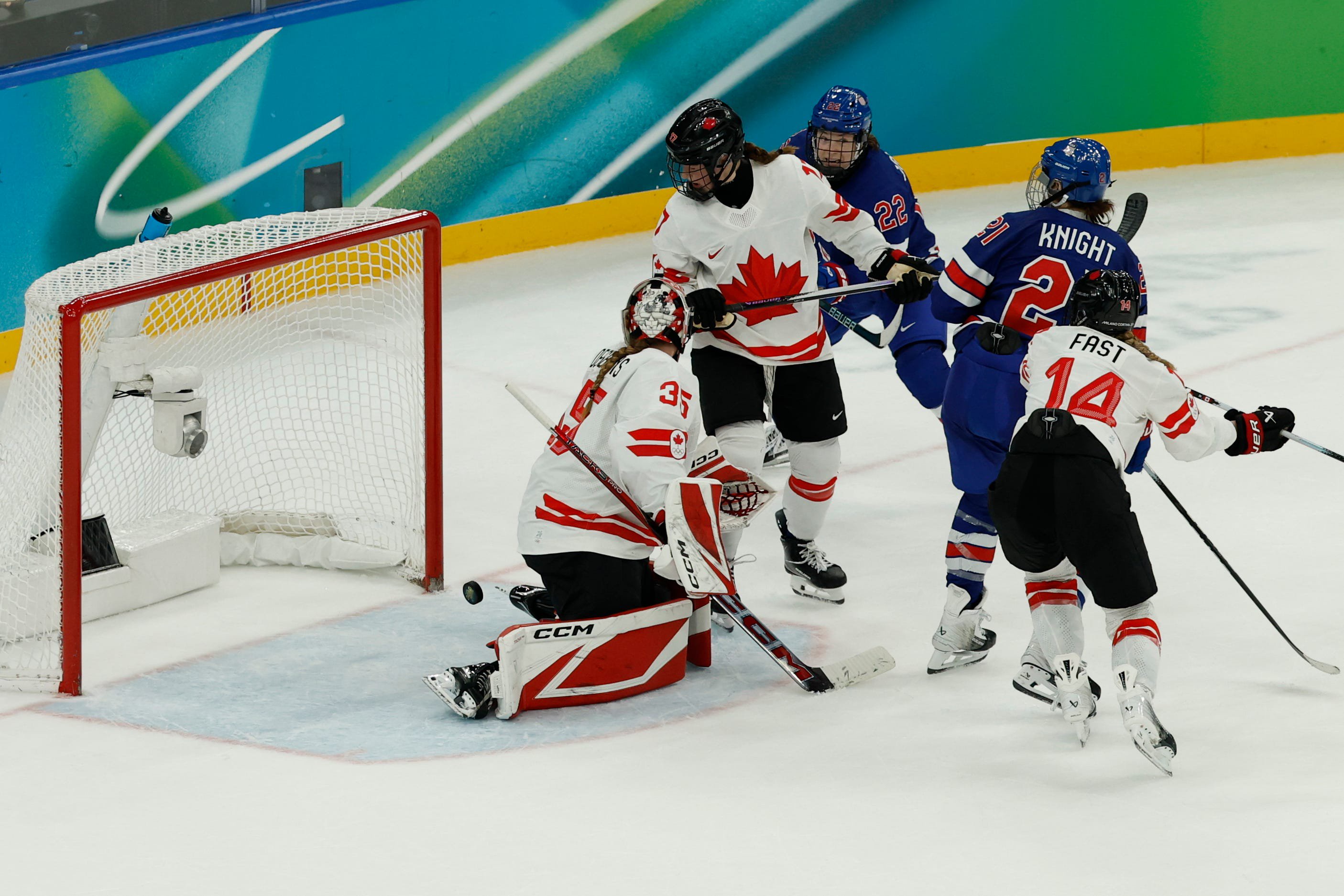 Hilary Knight (21) of the United States scores a goal against Ann-Renee Desbiens (35) of Canada in the women's ice hockey gold medal game during the Milano Cortina 2026 Olympic Winter Games at Milano Santagiulia Ice Hockey Arena in Milan on Thursday, Feb. 19, 2026.