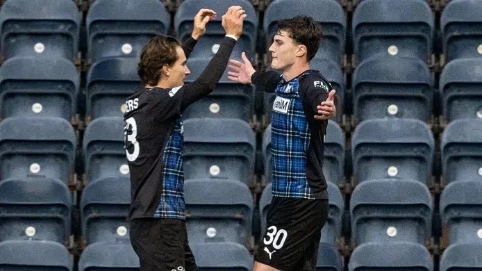 St Johnstone's Logan Chalmers congratulates goalscorer Joel Cotterill