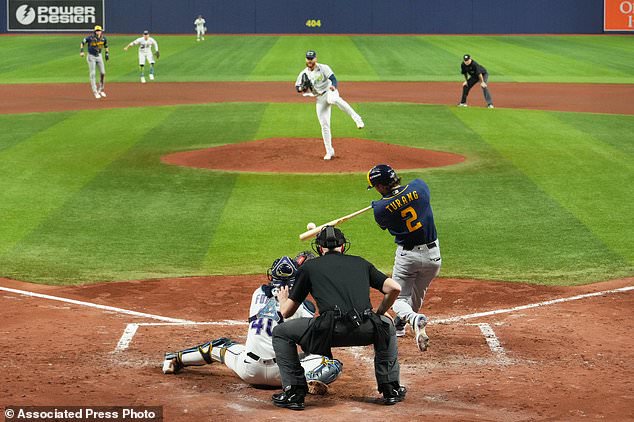 Milwaukee Brewers' Brice Turang hits two-run single during the fifth inning of Game 3 of baseball's World Series, Monday, Oct. 26, 2026, in St. Petersburg, Fla., between the Milwaukee Brewers and the Tampa Bay Rays. (AP Photo/Ashley Landis)
