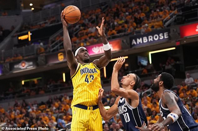 Indiana Pacers forward Pascal Siakam (43) looks to shoot over Dallas Mavericks forward Zaccharie Risacher (10) during the first half of an NBA basketball game in Indianapolis, Friday, Oct. 23, 2026. (AP Photo/AJ Mast)
