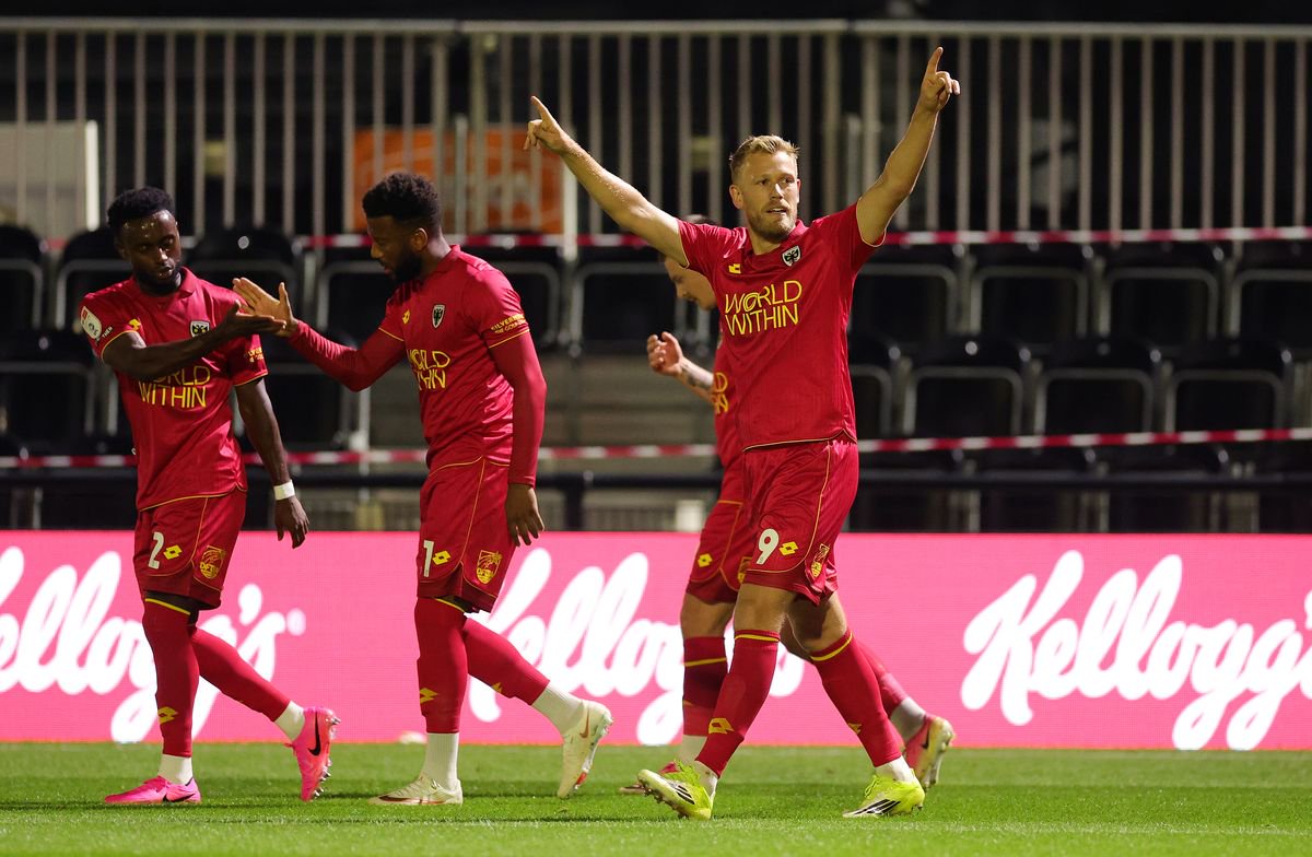 BROMLEY, ENGLAND - SEPTEMBER 07: Jayden Stockley of AFC Wimbledon celebrates with his team mates after scoring his side's first goal during the Sky Bet League One 2026/27 match between Bromley and AFC Wimbledon at Copperjax Community Stadium on September 07, 2026 in Bromley, England. (Photo by Andrew Redington/Getty Images)