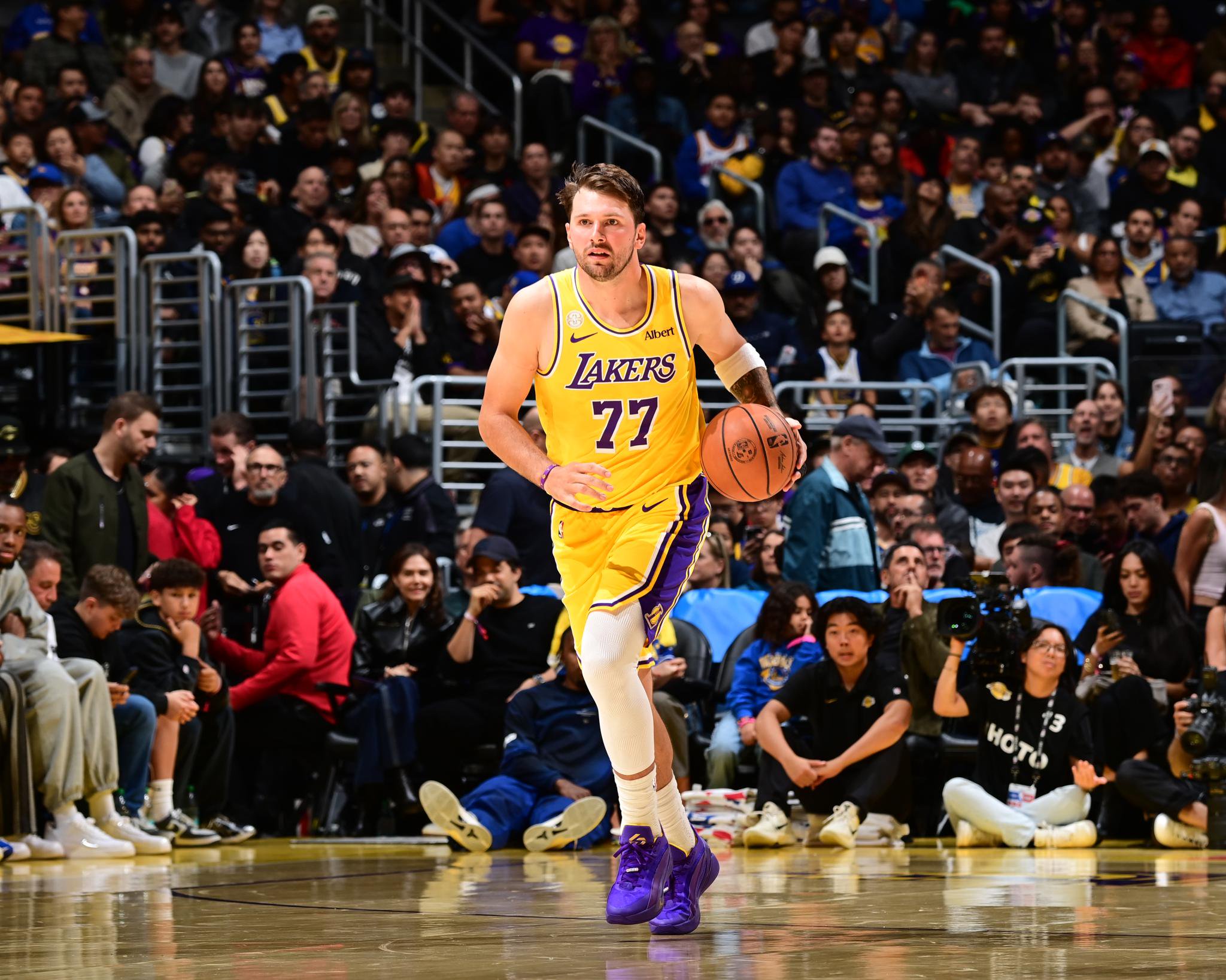 Luka Doncic of the Los Angeles Lakers dribbles the ball during a game against the Golden State Warriors.