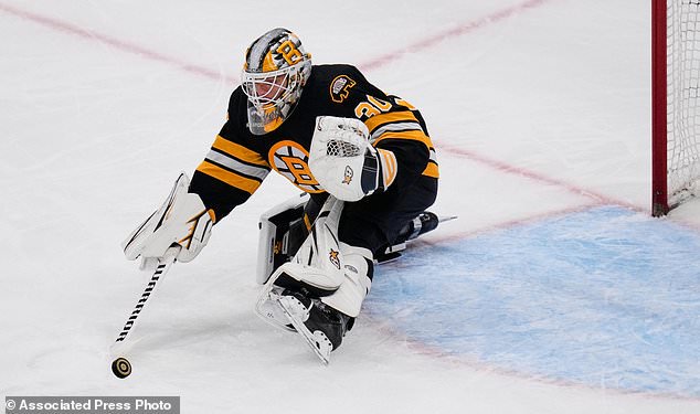 Boston Bruins goalie Michael DiPietro makes a save during the second period of an NHL hockey game against the Nashville Predators, Thursday, Oct. 22, 2026, in Boston. (AP Photo/Charles Krupa)