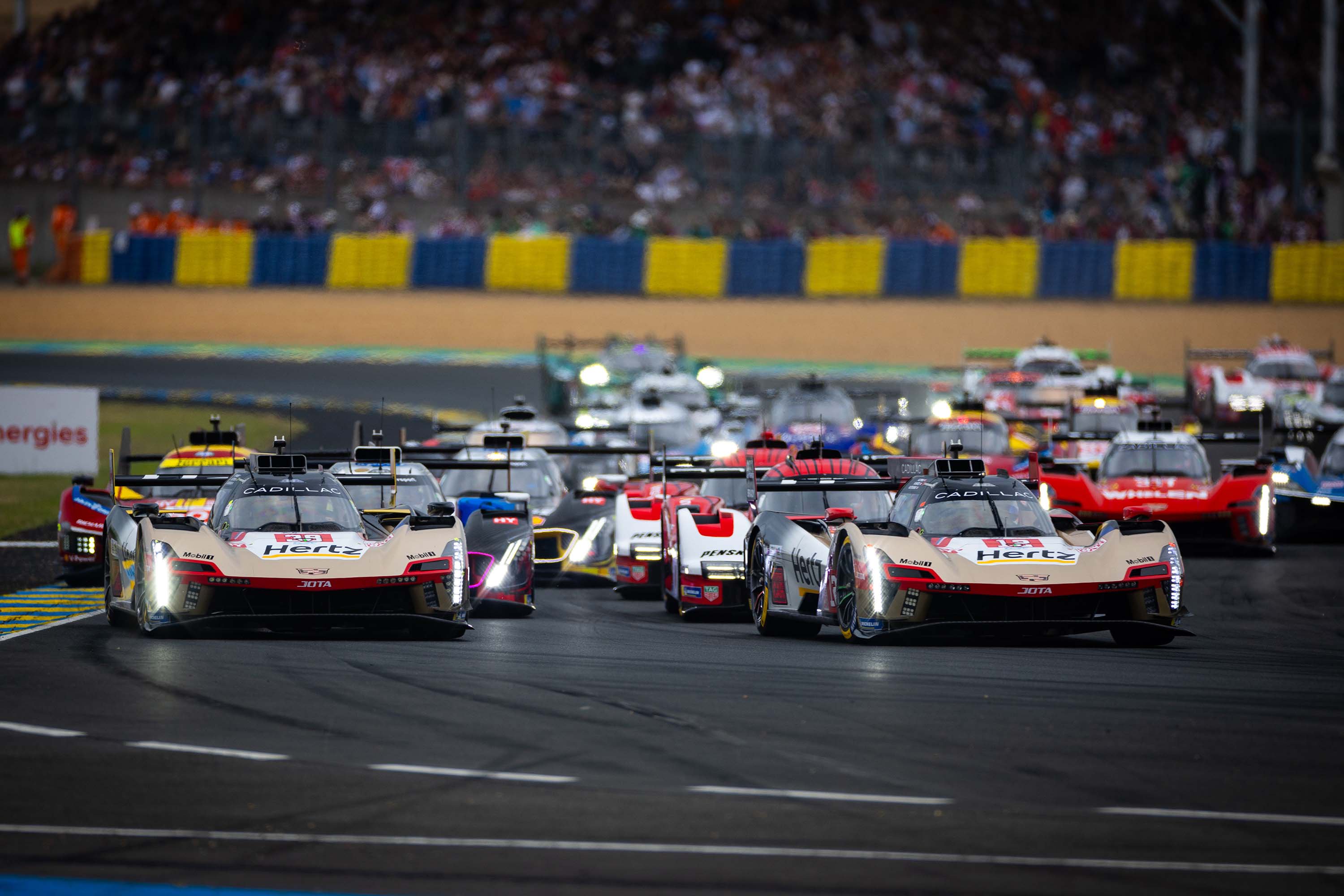 The No. 12 and No. 38 Cadillac V-Series.R Hypercars lead the start of the 2025 24 Hours of Le Mans from pole position. Cadillac Racing could join up with Team Penske to enter the race in 2028. 