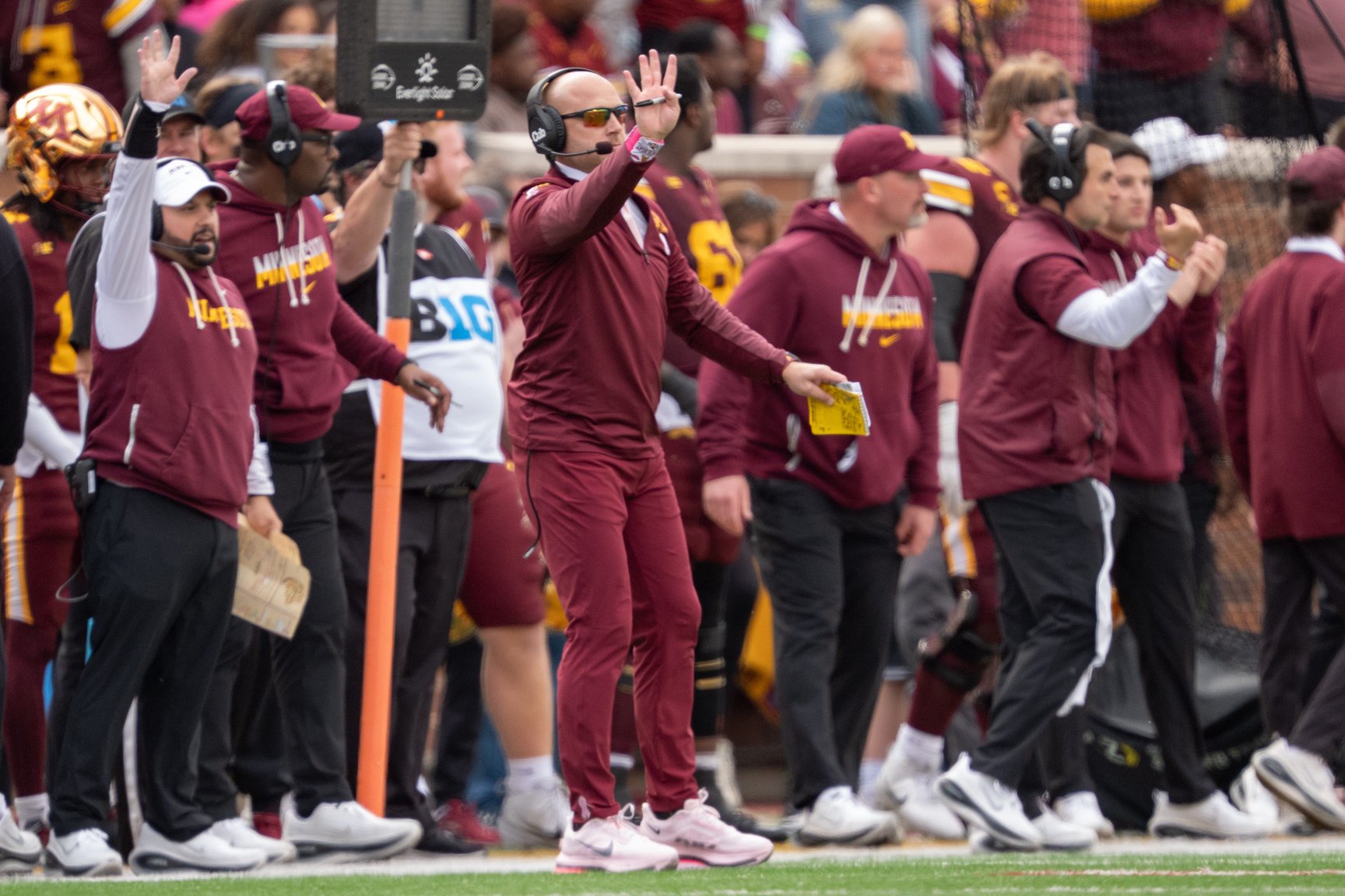 Minnesota Golden Gophers head coach P.J. Fleck signals to players on the field in the fourth quarter of the game against the Michigan Wolverines at Huntington Bank Stadium, Oct. 3, 2026 in Minneapolis.