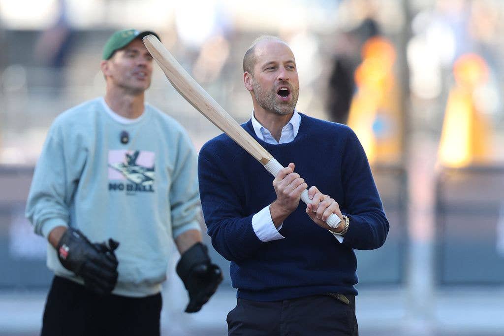 Prince William reacts to a shot with Sir James Anderson during Earthshot's "Cricket On The Mall" 
