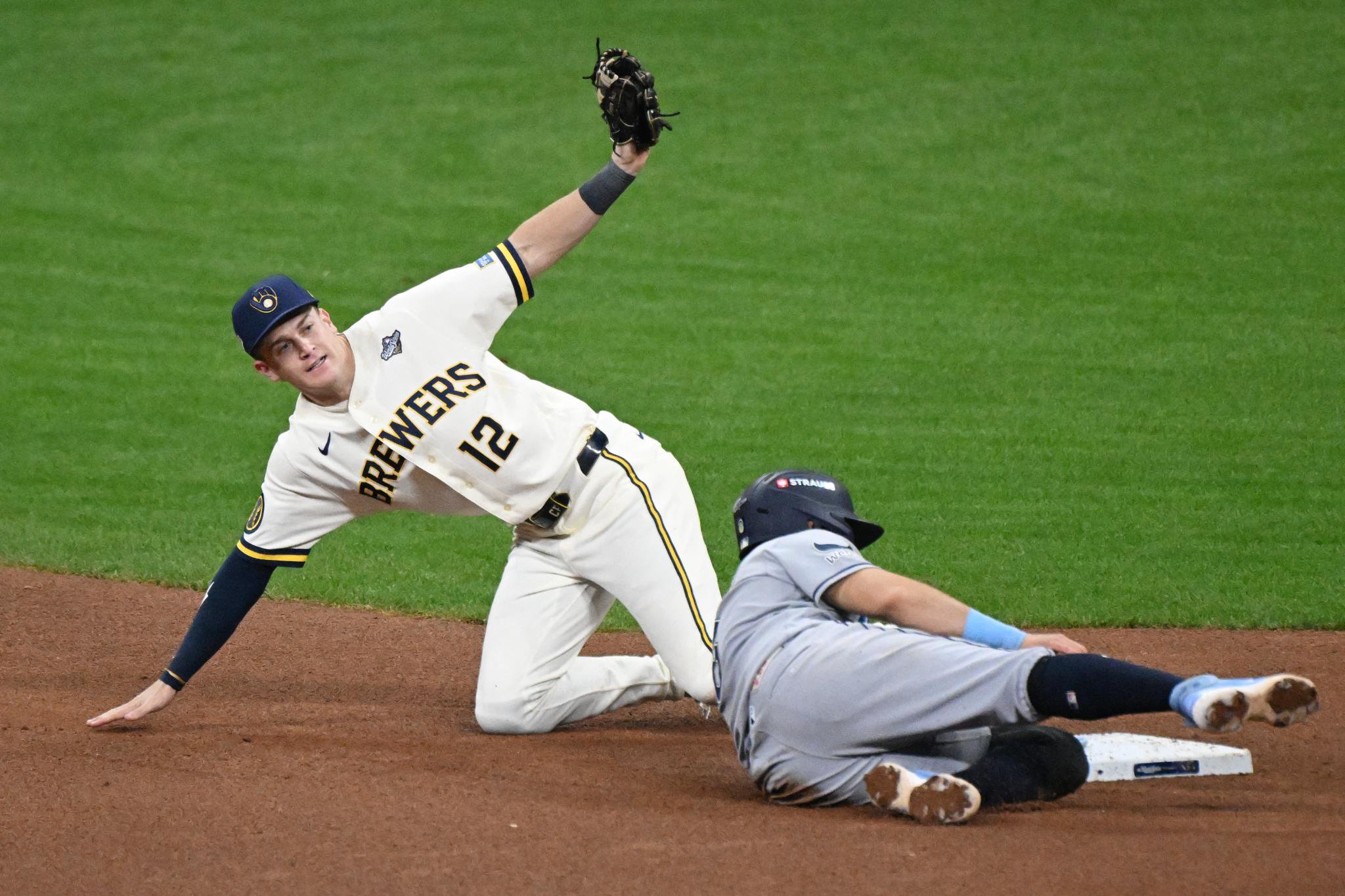 Milwaukee Brewers shortstop Cooper Pratt tags out Tampa Bay Rays first baseman Jonathan Aranda during a game.