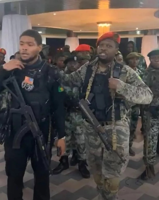 Coup leader Christian Malanga (right) who was shot during the attack with his son Marcel (left)