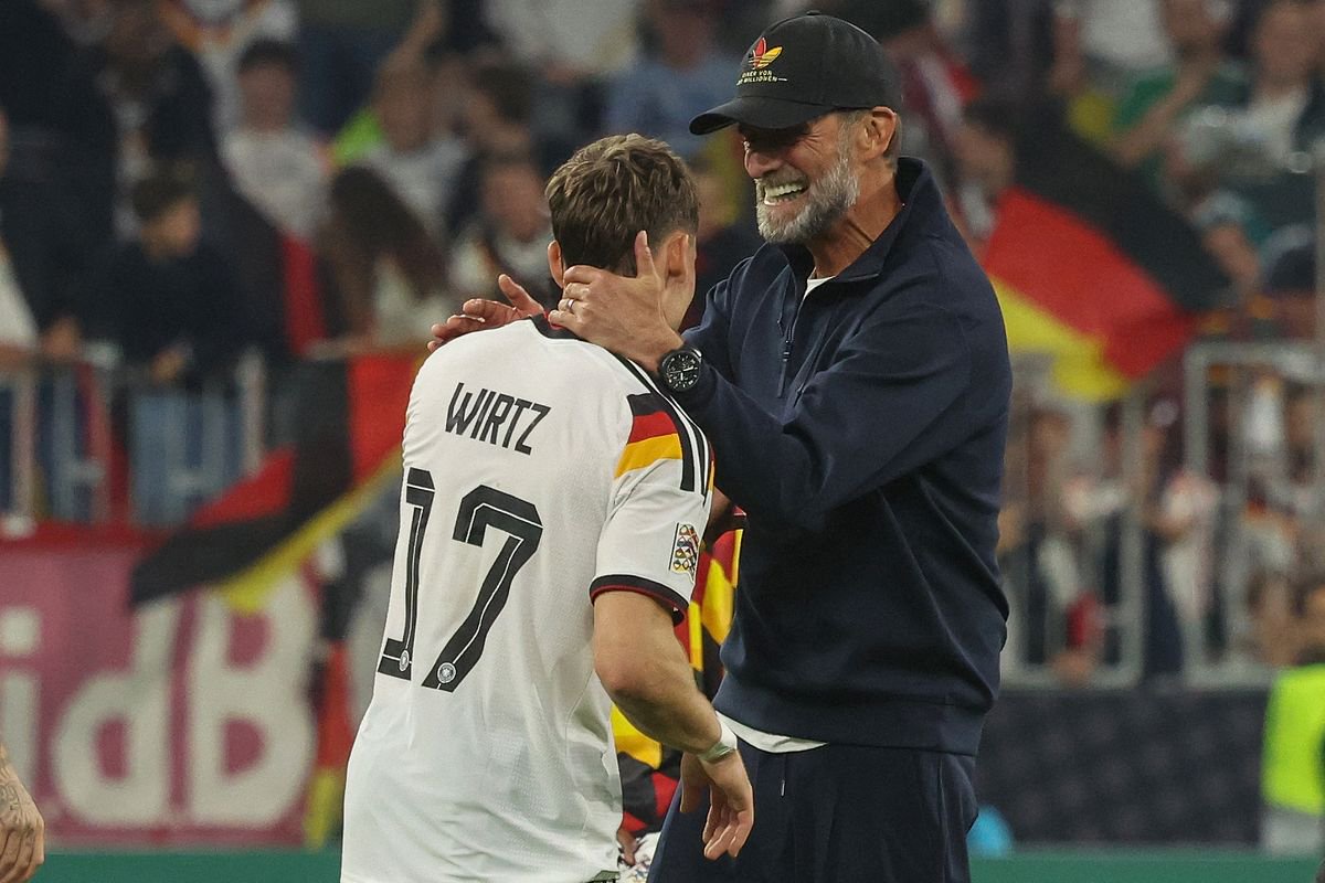 Germany's coach Jurgen Klopp congratulates Germany's midfielder #17 Florian Wirtz after the UEFA Nations League Group A2 between Germany and Serbia at the Allianz Arena in Munich, southern Germany on October 1, 2026. (Photo by Karl-Josef HILDENBRAND / AFP via Getty Images)