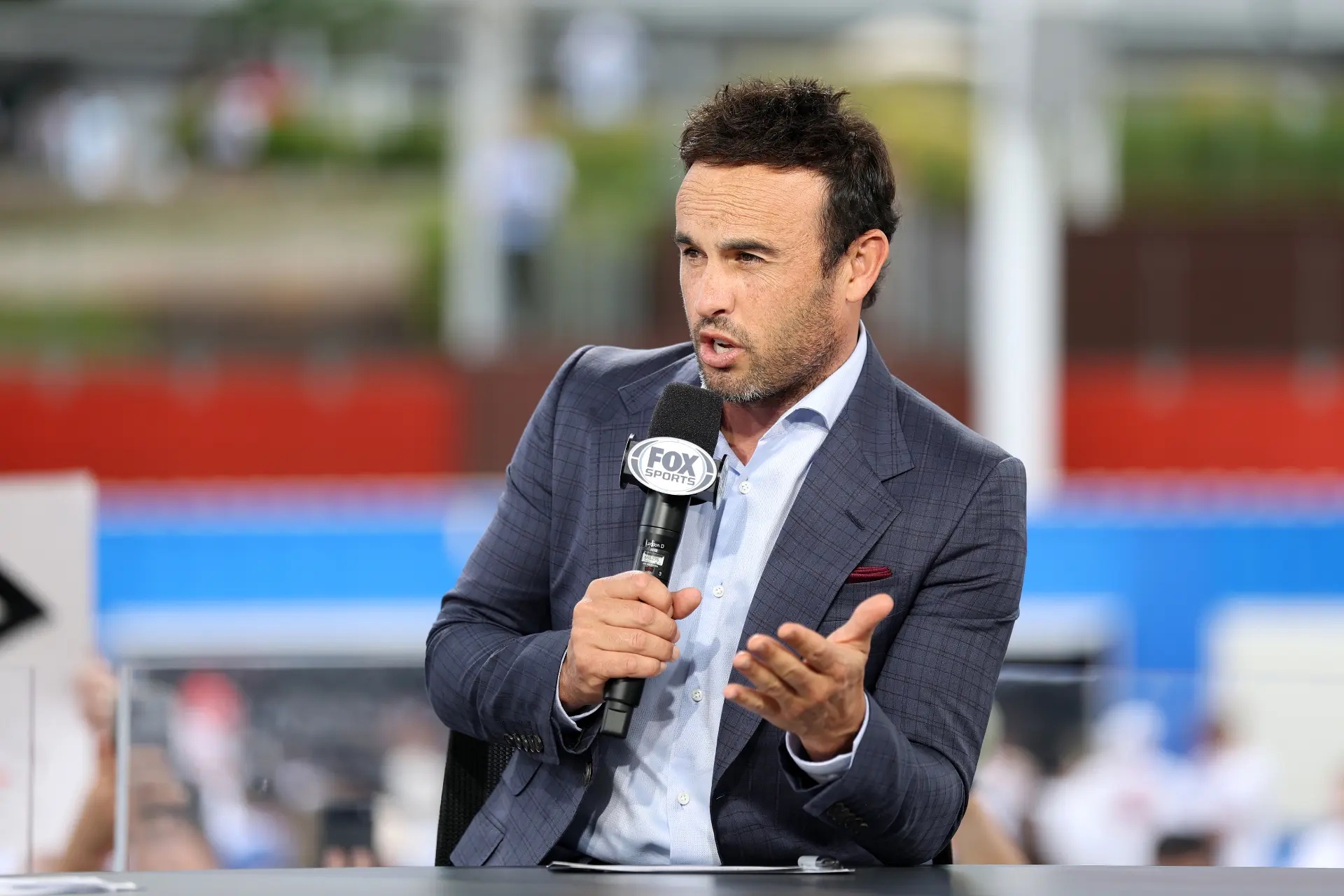 Landon Donovan talking into a microphone.