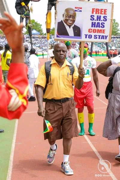 Reactions As Photo Of An Old Man In School Uniform With Free SHS Placard Goes Viral On Independence Day