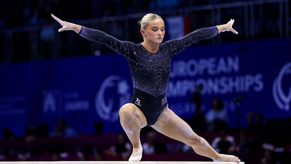 Ruby Evans competing on the balance beam in the 2026 European Championships