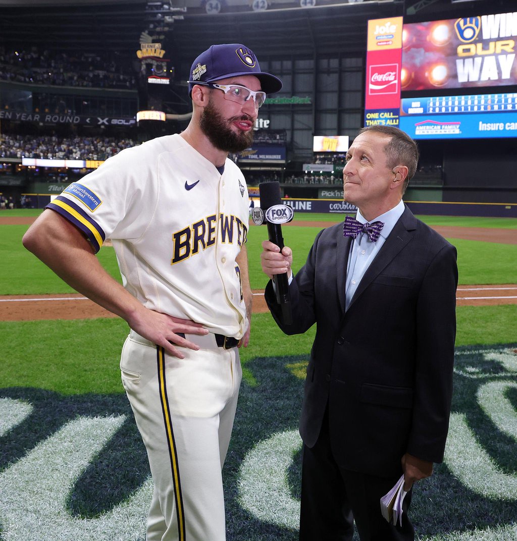 Fox Sports reporter Ken Rosenthal interviews Aaron Ashby of the Milwaukee Brewers on the field.