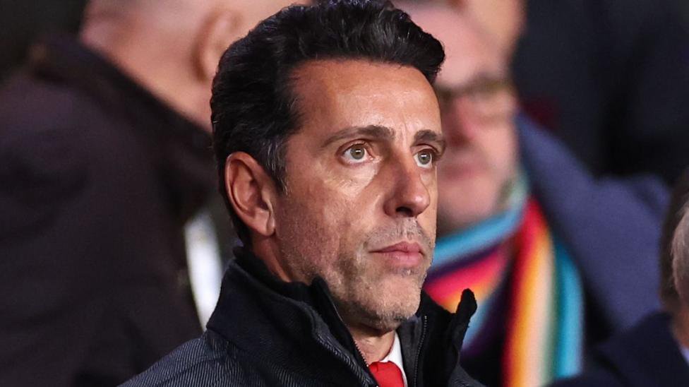 Edu Gaspar in a crowd at a football match.
